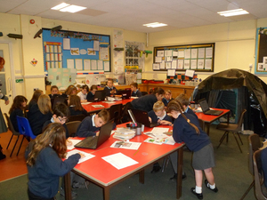 A primary school class working on their research of the local war memorial © War Memorials Trust, 2013