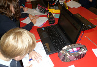 Children using the CWGC website to research war casualties © War Memorials Trust, 2012