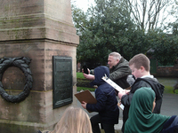 Year 4 pupil from Summerbank Primary School carrying out condition survey for Tunstall war memorial © War Memorials Trust, 2019
