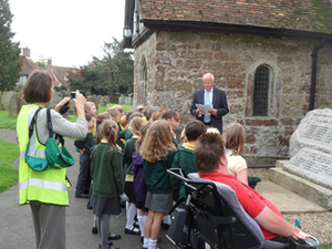 School visit to Lenham war memorial stone © War Memorials Trust, 2014