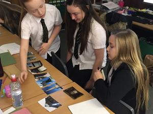 P7 pupils from SS Peter and Paul's RC Primary School looking at war memorial images © SS Peter and Paul's RC Primary, 2018 