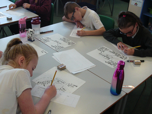 P6 pupils from Cockenzie Primary School creating a cartoon strip to show events which took place on 11th November 1918 onwards © War Memorials Trust, 2018