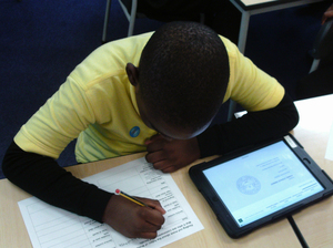 Year 4 pupil from Kings Avenue School researching names on local war memorials © War Memorials Trust, 2019