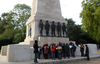 Primary school pupils looking at a war memorial © War Memorials Trust, 2012